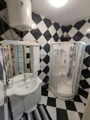 a bathroom with a sink and a shower at Index 3 in Banja Luka