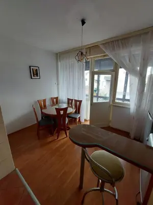 a living room with a dining room table and chairs at Index 3 in Banja Luka