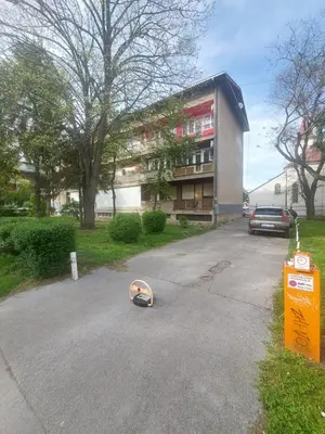 a skateboard laying on the street in front of a building at Index 3 in Banja Luka