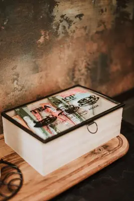 a wooden box sitting on top of a wooden table at Apartman at 8th in Banja Luka