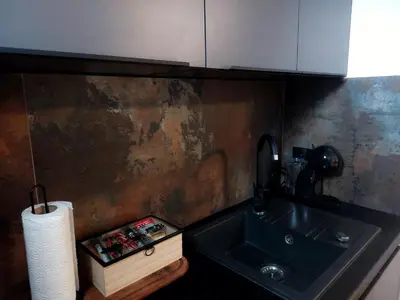 a kitchen with a sink and a roll of paper towels at Apartman at 8th in Banja Luka