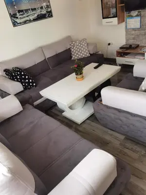 a living room with a couch and a table at Halal Holidey Kuća za odmor in Spahići