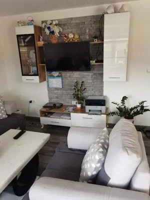 a living room with a couch and a tv at Halal Holidey Kuća za odmor in Spahići