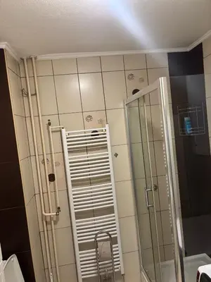 a bathroom with a shower and a glass door at Apartman Centar in Banja Luka