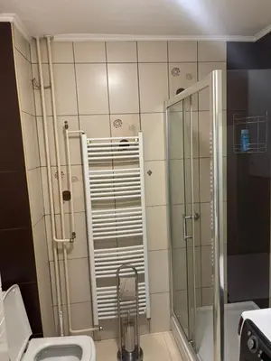 a bathroom with a shower and a toilet at Apartman Centar in Banja Luka