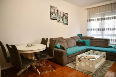 a living room with a couch and a table at Apartman Atrium Banja Luka in Banja Luka