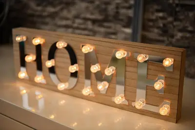 a sign that says love with lights on it at Apartman Atrium Banja Luka in Banja Luka