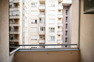 a view of a tall building from a window at Apartman Atrium Banja Luka in Banja Luka