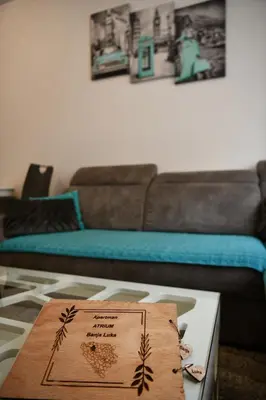a living room with a couch and a table at Apartman Atrium Banja Luka in Banja Luka
