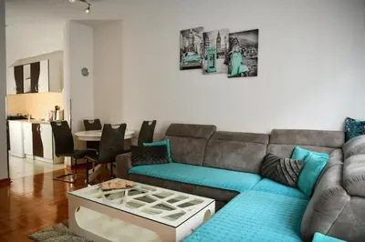 a living room with a couch and a table at Apartman Atrium Banja Luka in Banja Luka