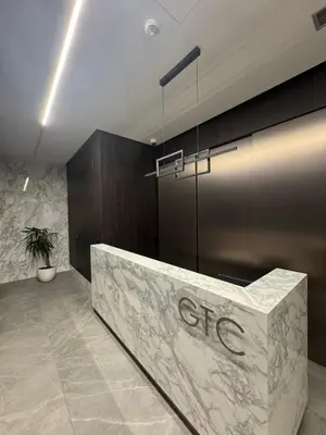 a lobby with a reception desk in a building at Apartman DK VIII in Banja Luka