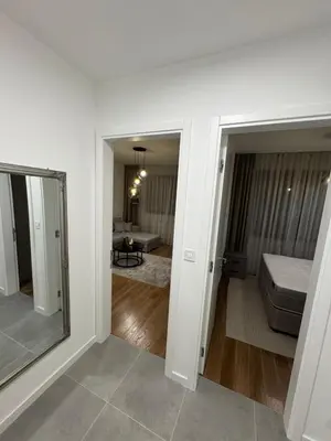 a room with a bed and a living room at Apartman AK IX in Banja Luka