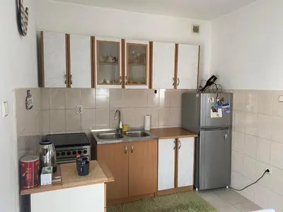 a small kitchen with a sink and a refrigerator at Apolon I Apartment in Banja Luka