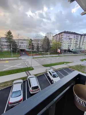 a group of cars parked in a parking lot at Apartman BULEVAR1 sa garažom in Doboj