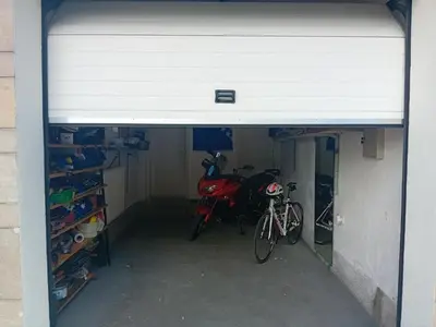 a garage with two bikes parked inside of it at Apartman Orhideja in Bihać