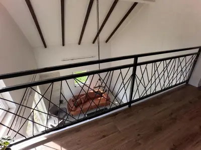 a balcony with a railing in a room at Villa Maglić Vlašić in Vlasic