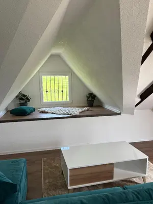 a living room with a white table and a window at Villa Maglić Vlašić in Vlasic