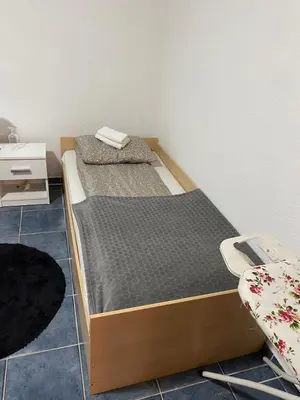 a bedroom with two beds in a room at Apartmani Alejna in Sanski most