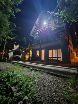a house at night with the light shining on it at Kuća za odmor Carpe Diem in Bosanski Petrovac