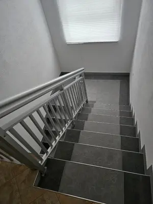 a staircase in a room with a window at Villa Voljička in Trnovača