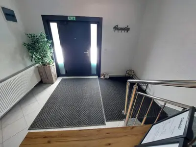 an entrance to a building with a glass door at Urban home apartments in Bihać