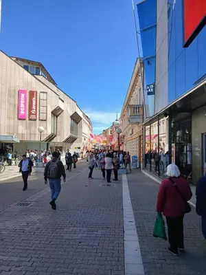 a group of people walking down a city street at Palata Suite in Banja Luka