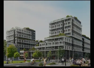 two tall buildings with people walking in front of them at Palata Suite in Banja Luka