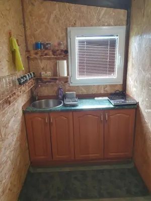 a small kitchen with a sink and a window at Blanca 6 in Nova Bila