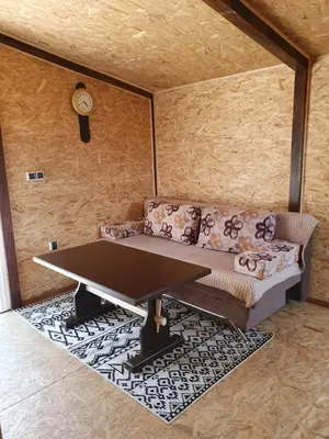 a living room with a couch and a table at Blanca 6 in Nova Bila