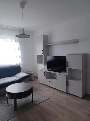 a living room with a couch and a tv at Hilandar in Teslić