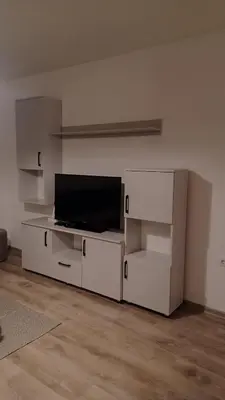 a living room with a flat screen tv on a wall at Hilandar in Teslić