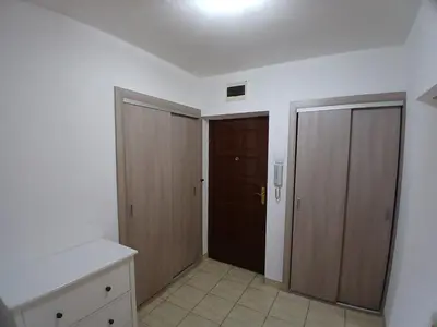 an empty room with two closets and a door at K&N centar Doboj in Doboj