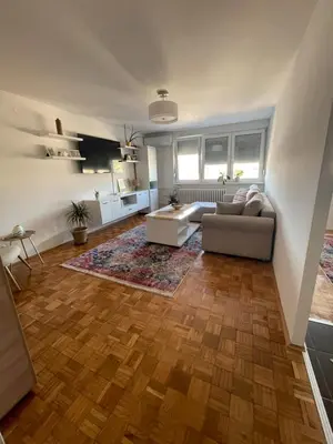 a living room with a couch and a table at Bambi Zenica in Zenica