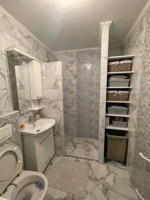 a bathroom with a toilet and a sink and a shower at Bambi Zenica in Zenica