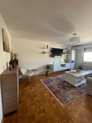 a living room with a couch and a table at Bambi Zenica in Zenica