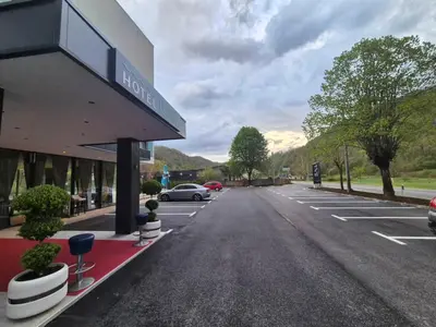 an empty parking lot in front of a hotel at Hotel Luna Bihać in Bihać