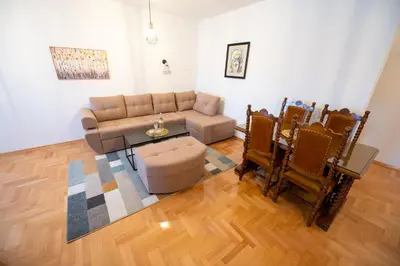 a living room with a couch and a table at Apartman Magija in Banja Luka