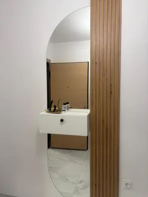 a bathroom with a white sink and a mirror at Apartman ADA in Železnička Stanica Incel