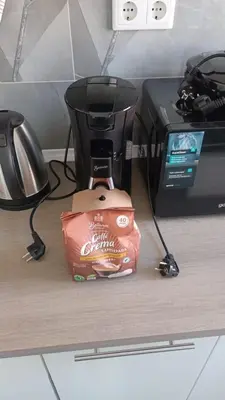 a coffee maker and a bag of food on a counter at Apartman Zana in Visoko