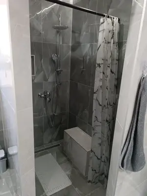 a bathroom with a shower with a shower curtain at Apartman Zana in Visoko