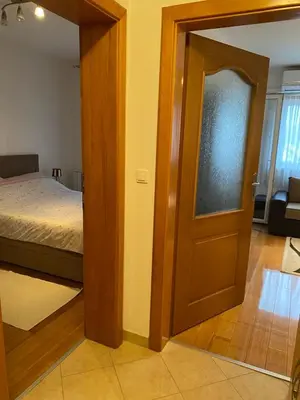 a room with a door leading to a bedroom at Apartman Nasic in Bihać
