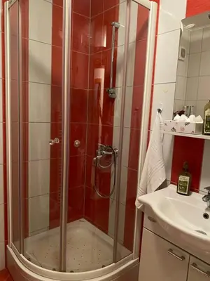 a bathroom with a shower and a sink at Apartman Nasic in Bihać