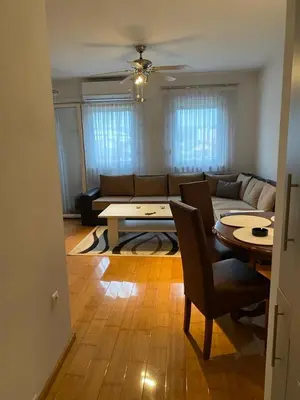 a living room with a couch and a table at Apartman Nasic in Bihać