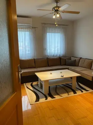 a living room with a couch and a coffee table at Apartman Nasic in Bihać