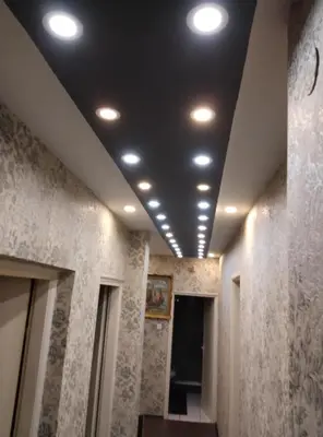 a hallway with a row of lights on a ceiling at KONAK kod ODISEJE in Tuzla