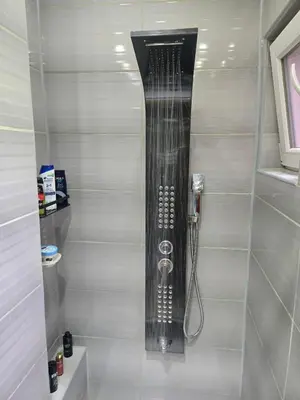 a bathroom with a shower with a hose at KONAK kod ODISEJE in Tuzla