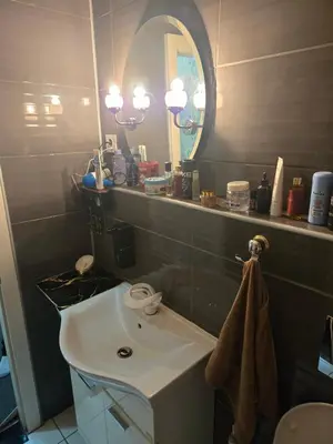 a bathroom with a sink and a mirror at KONAK kod ODISEJE in Tuzla