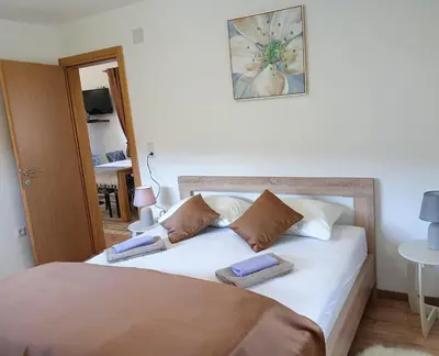 a bedroom with a bed with two pillows on it at Vila Medo in Kulen Vakuf
