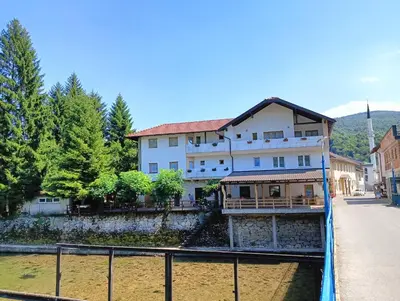 a building on the side of a river at Vila Medo in Kulen Vakuf