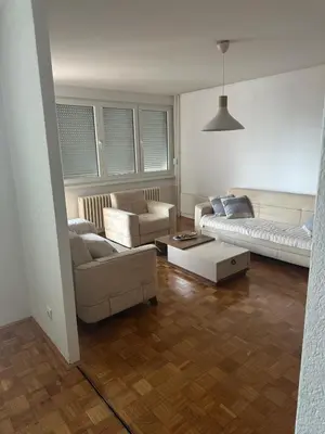 a living room with a couch and a table at Stan in Zenica
